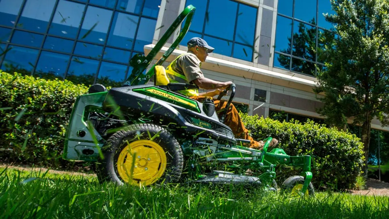 Commercial grounds maintenance crew mowing a business property in London, Ontario