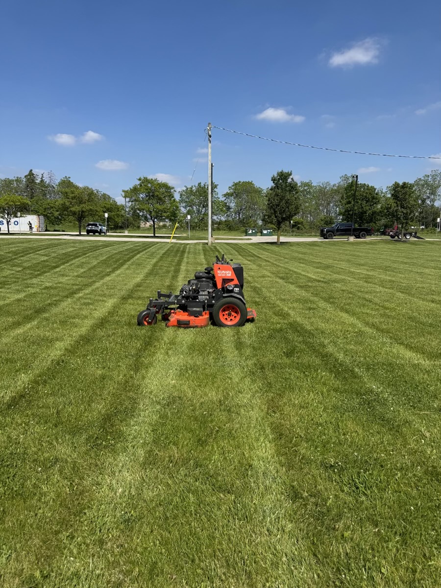Clean commercial lawn mowing stripes by Brothers Landscaping