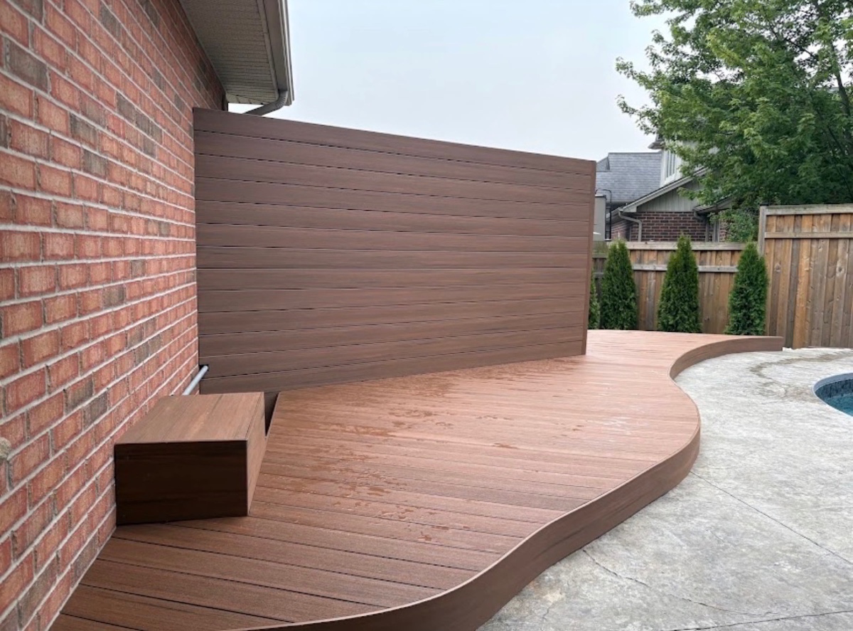 Finished outdoor deck and privacy-screen patio project by Brothers Landscaping